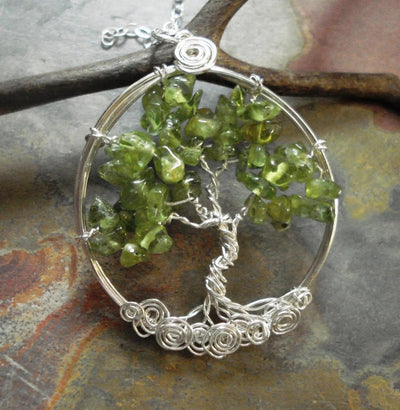Handmade sterling silver Tree of Life necklace with green peridot gemstone leaves wire wrapped pendant